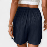 Nina - Shorts di stile con pieghe frontali