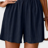 Nina - Shorts di stile con pieghe frontali