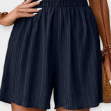 Nina - Shorts di stile con pieghe frontali