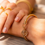Bracciale dorato con motivo a moneta